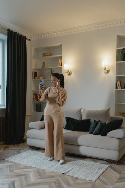 A smiling woman meditating peacefully in a cozy and well-lit home environment